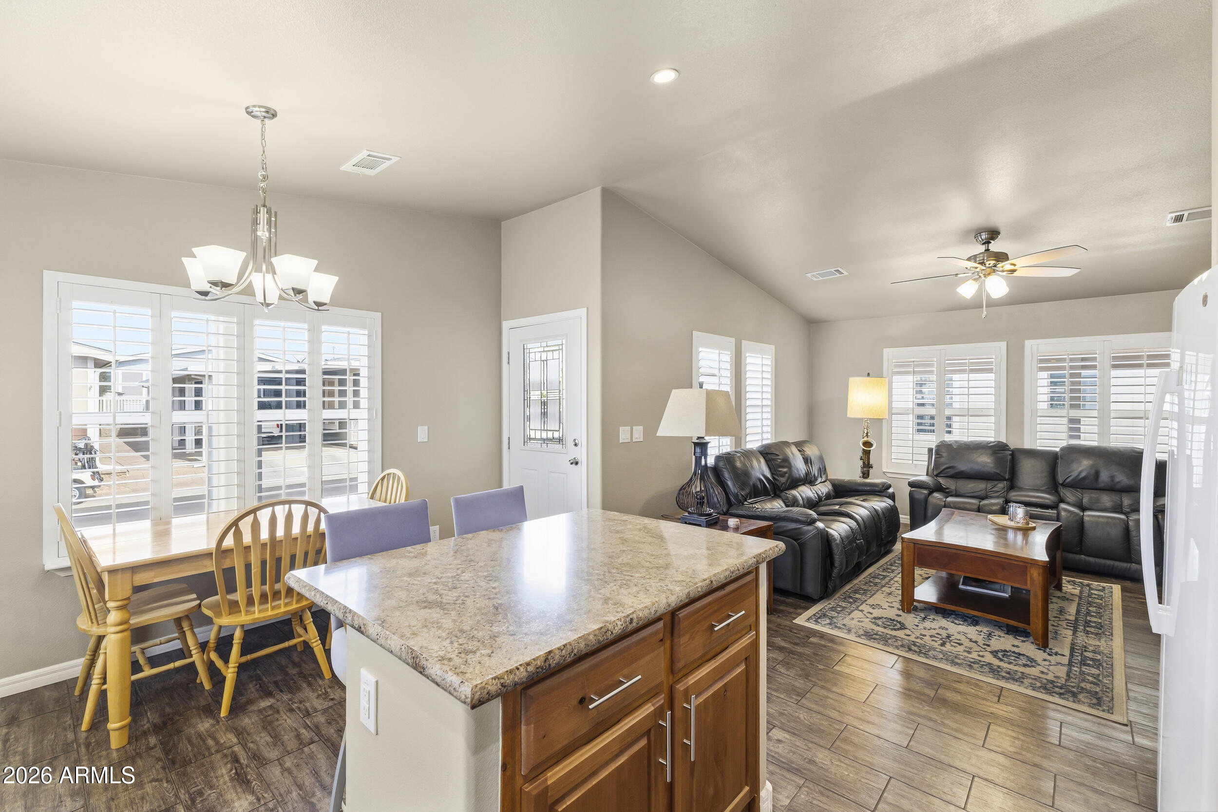 650 North Hawes Road, Unit 3509 Mesa, AZ 85207 - Photo 10 of 43 a view of a dining room with furniture window and outside view