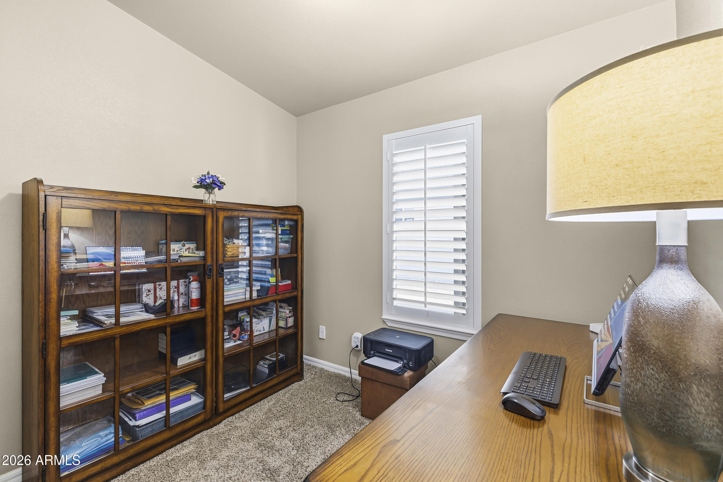 650 North Hawes Road, Unit 3509 Mesa, AZ 85207 - Photo 12 of 43 a workspace with a bookshelf