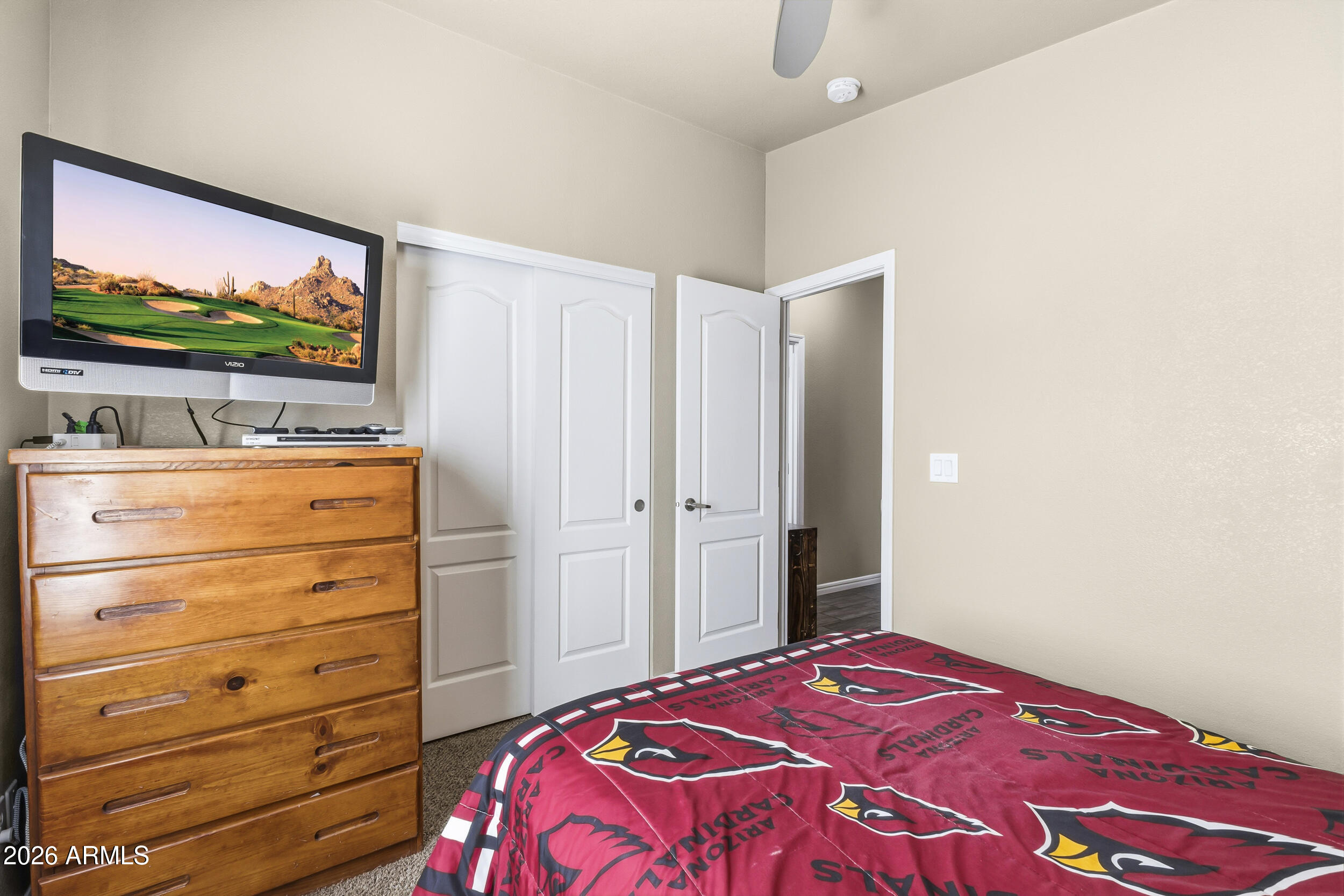 650 North Hawes Road, Unit 3509 Mesa, AZ 85207 - Photo 20 of 43 a bedroom with a bed and a flat screen tv