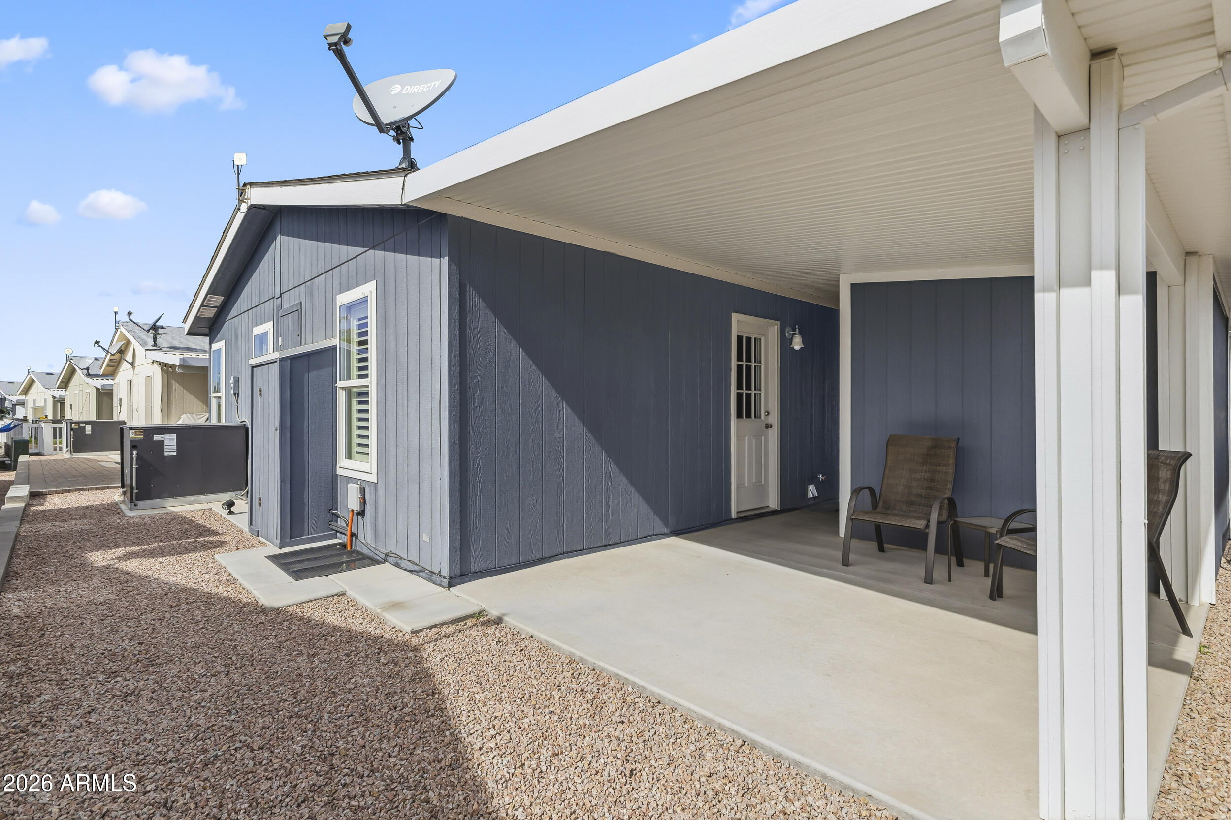 650 North Hawes Road, Unit 3509 Mesa, AZ 85207 - Photo 22 of 43 a bedroom with a bed and a chair