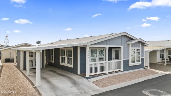 a bedroom with a bed and a chair