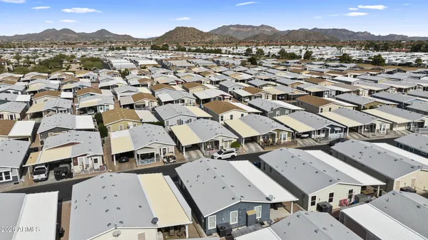 an aerial view of residential houses with outdoor space