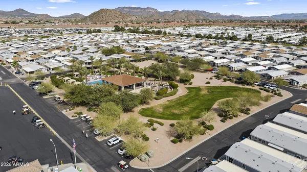 an aerial view of a residential apartment building with yard