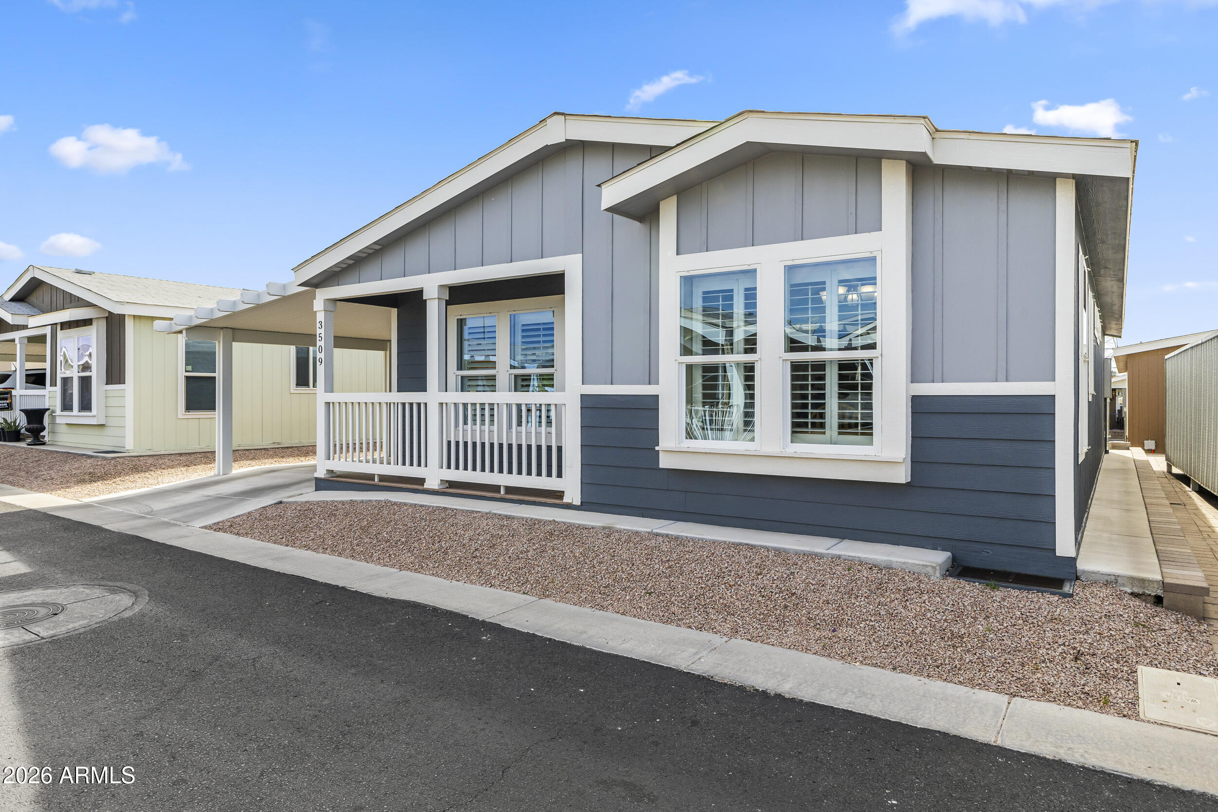 650 North Hawes Road, Unit 3509 Mesa, AZ 85207 - Photo 3 of 43 a front view of a house with a garage