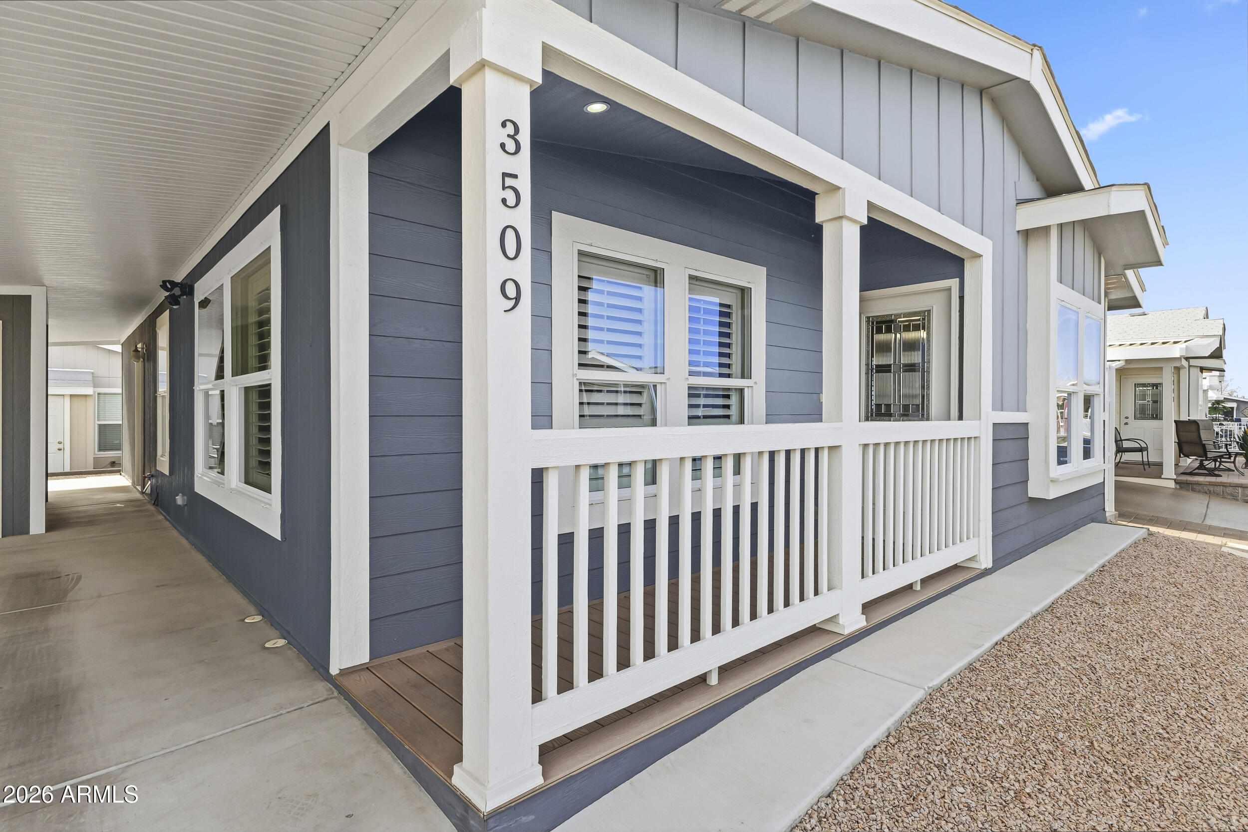 650 North Hawes Road, Unit 3509 Mesa, AZ 85207 - Photo 4 of 43 a view of a brick house with large windows