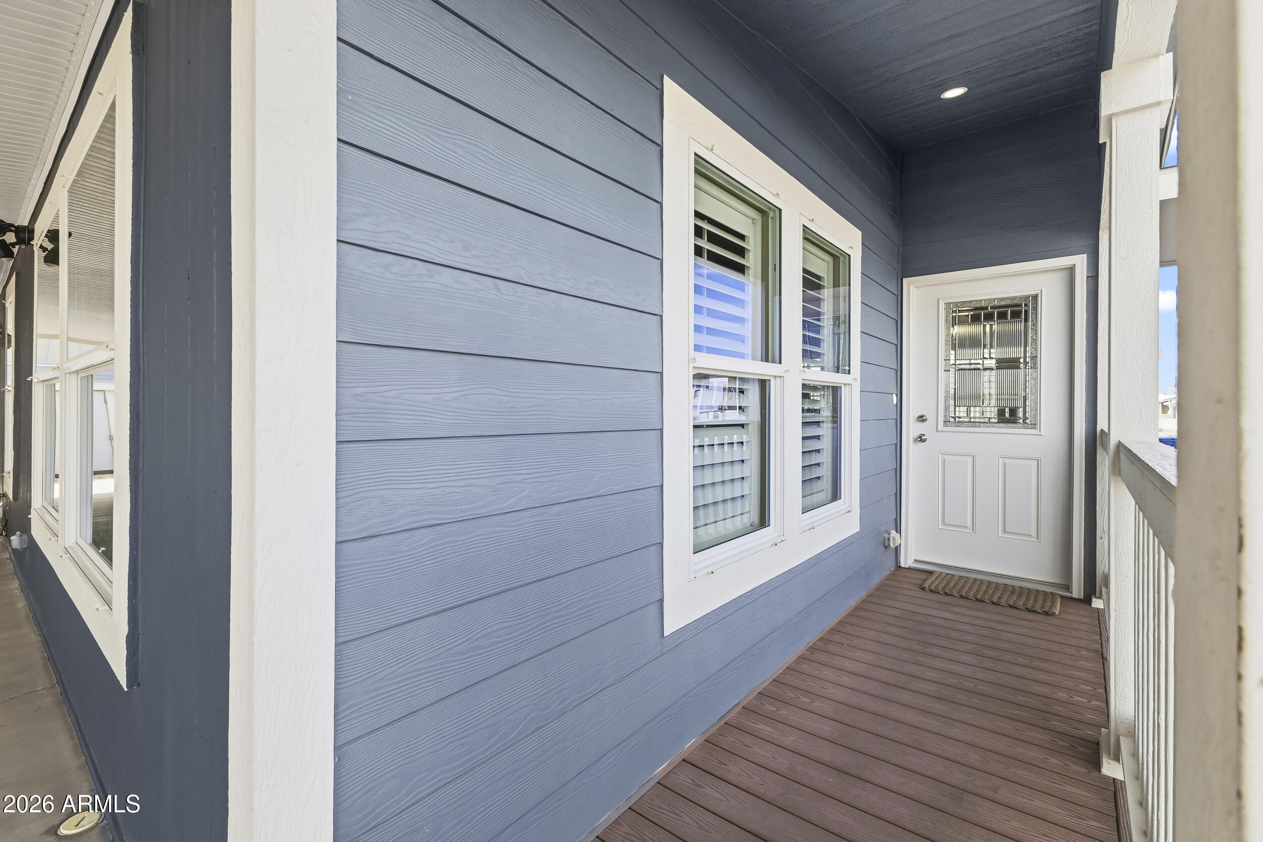 650 North Hawes Road, Unit 3509 Mesa, AZ 85207 - Photo 5 of 43 a view of a hallway with wooden floor and staircase