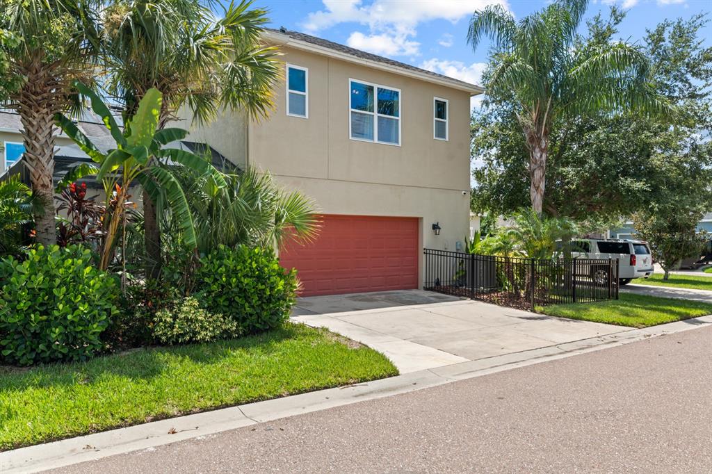 5955 Caldera Ridge Drive Lithia, FL 33547 - Photo 26 of 71 a front view of a house with a yard and garage