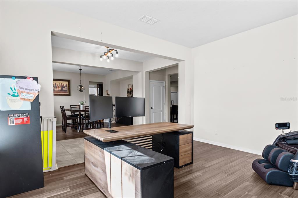 5955 Caldera Ridge Drive Lithia, FL 33547 - Photo 28 of 71 a kitchen with stainless steel appliances granite countertop a sink and a stove