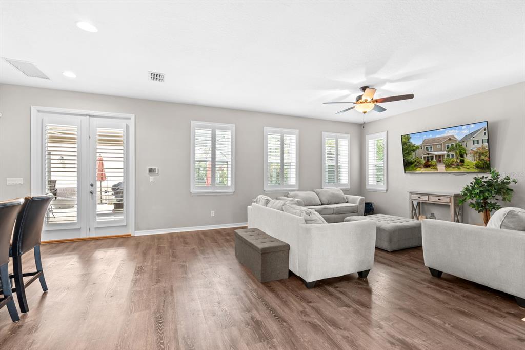 5955 Caldera Ridge Drive Lithia, FL 33547 - Photo 40 of 71 a living room with furniture and a large window