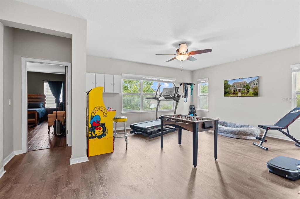 5955 Caldera Ridge Drive Lithia, FL 33547 - Photo 43 of 71 a living room with furniture and a wooden floor