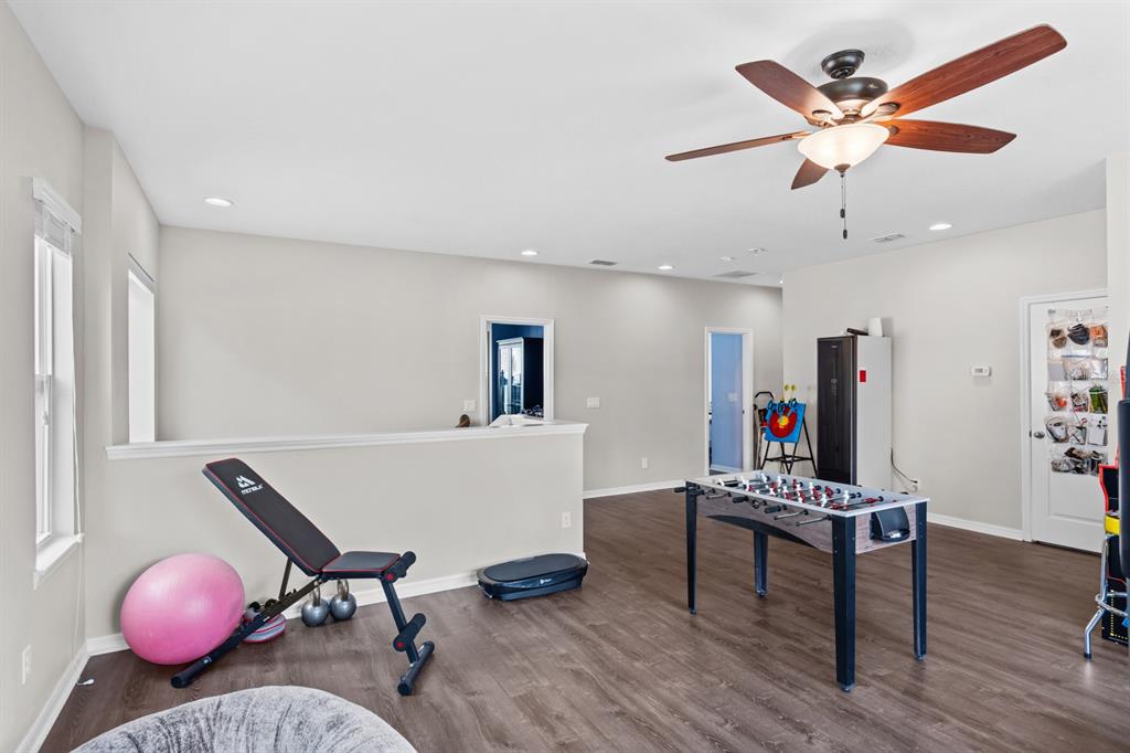 5955 Caldera Ridge Drive Lithia, FL 33547 - Photo 45 of 71 a living room with furniture and wooden floor