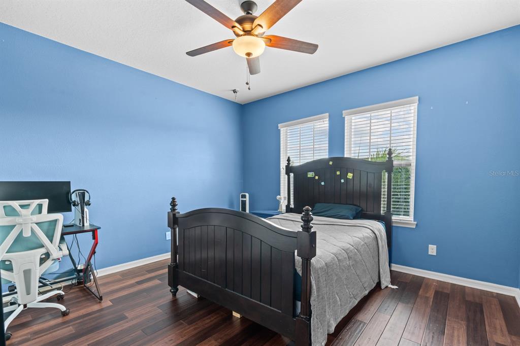 5955 Caldera Ridge Drive Lithia, FL 33547 - Photo 47 of 71 a bedroom with a bed and wooden floor