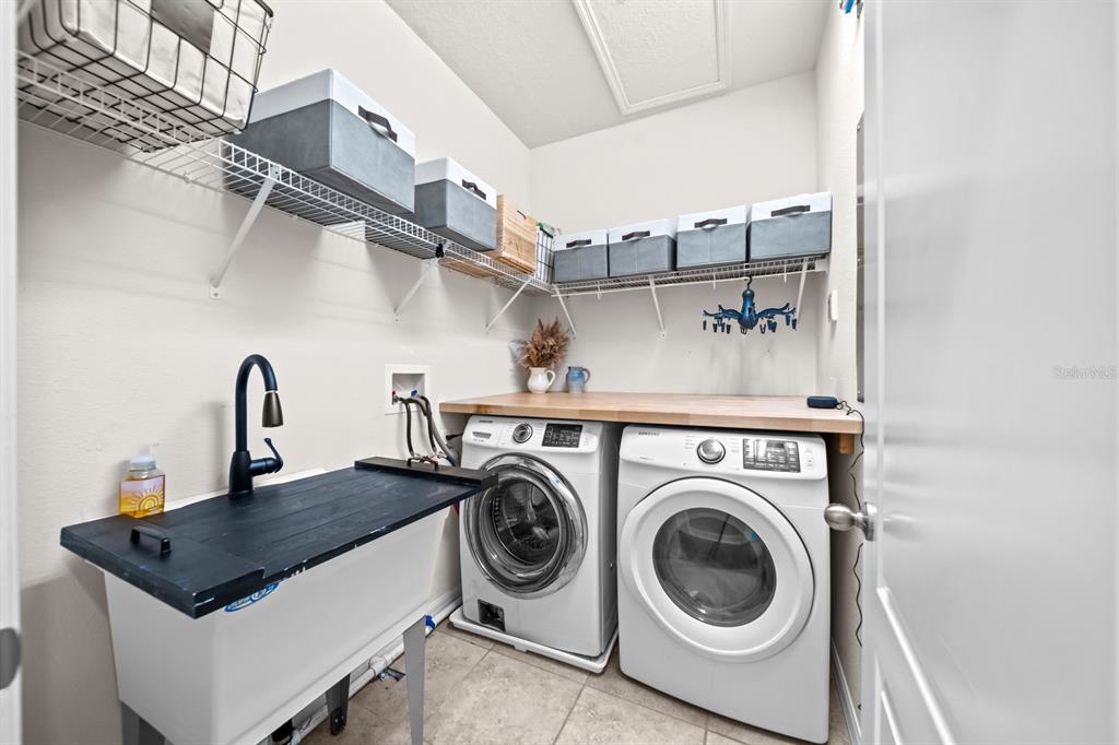 5955 Caldera Ridge Drive Lithia, FL 33547 - Photo 50 of 71 a utility room with dryer and washer