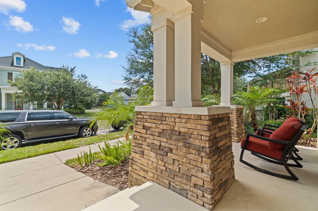 5955 Caldera Ridge Drive Lithia, FL 33547 - Photo 5 of 71 a view of an outdoor sitting area with furniture and garden view
