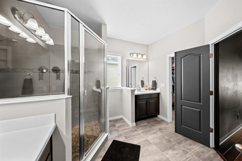 5955 Caldera Ridge Drive Lithia, FL 33547 - Photo 58 of 71 a kitchen with a refrigerator and a sink