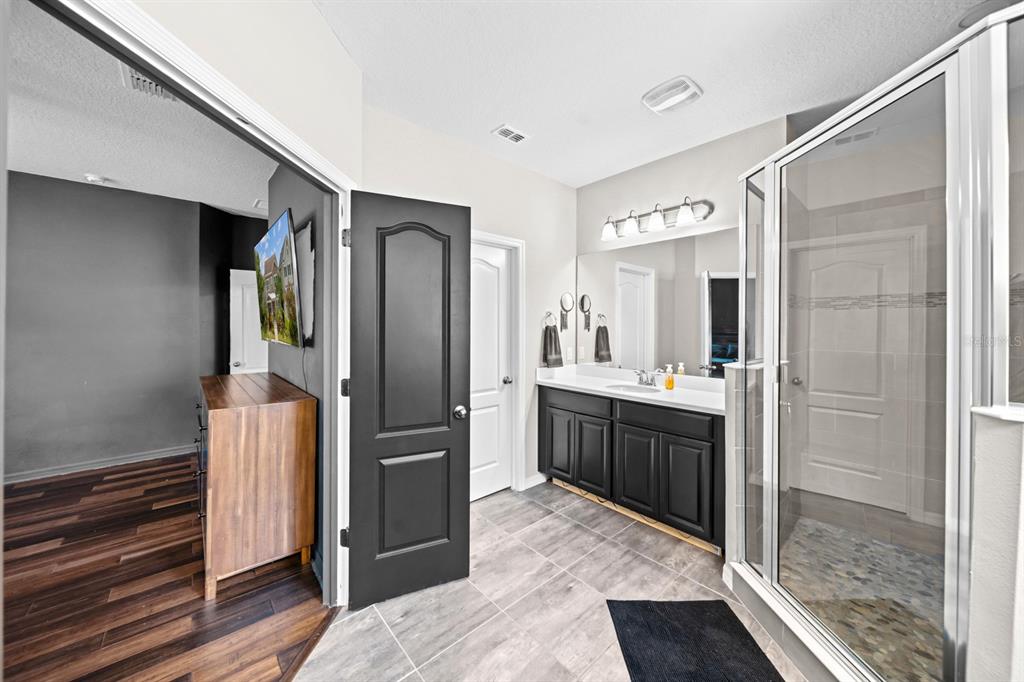 5955 Caldera Ridge Drive Lithia, FL 33547 - Photo 59 of 71 a kitchen with a refrigerator and a sink