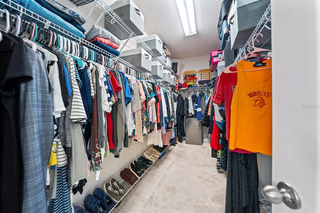 5955 Caldera Ridge Drive Lithia, FL 33547 - Photo 61 of 71 a view of walk in closet with clothes
