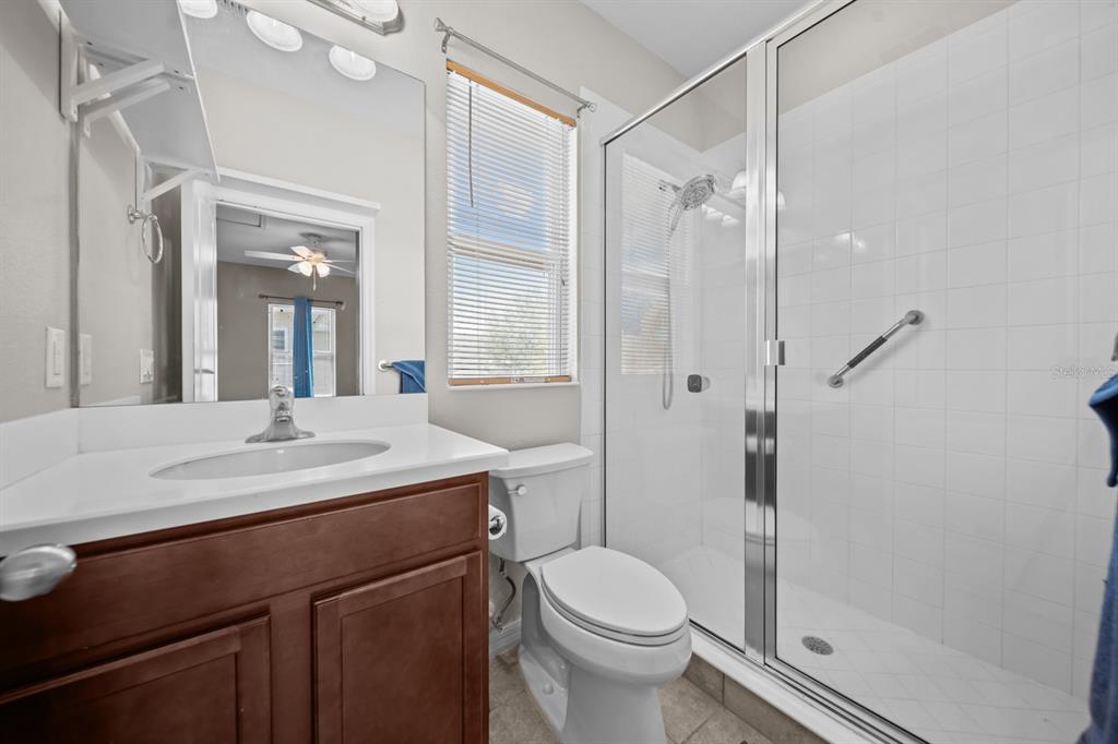 5955 Caldera Ridge Drive Lithia, FL 33547 - Photo 71 of 71 a bathroom with a sink toilet and shower
