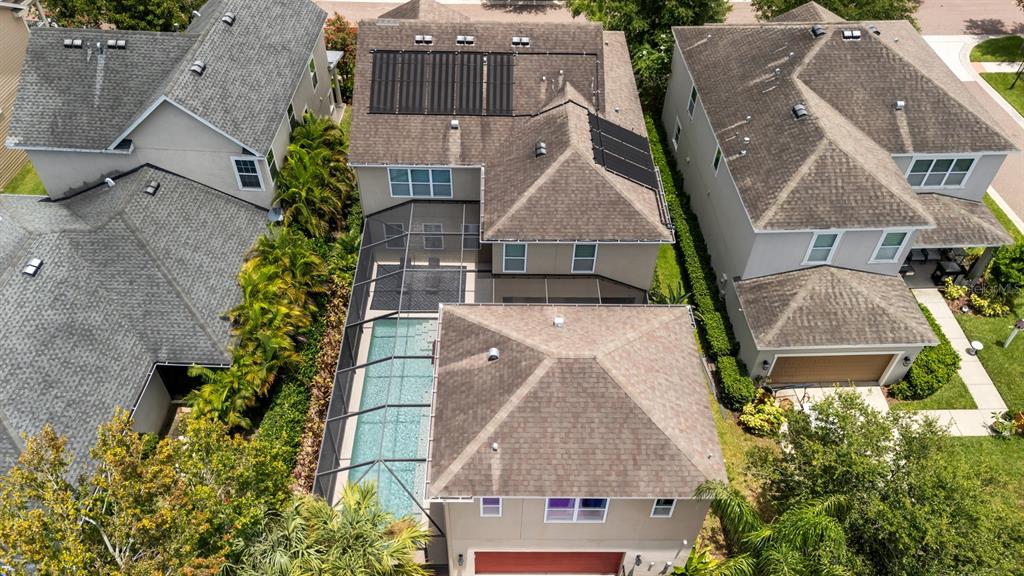 5955 Caldera Ridge Drive Lithia, FL 33547 - Photo 10 of 71 an aerial view of a house with a yard and garage
