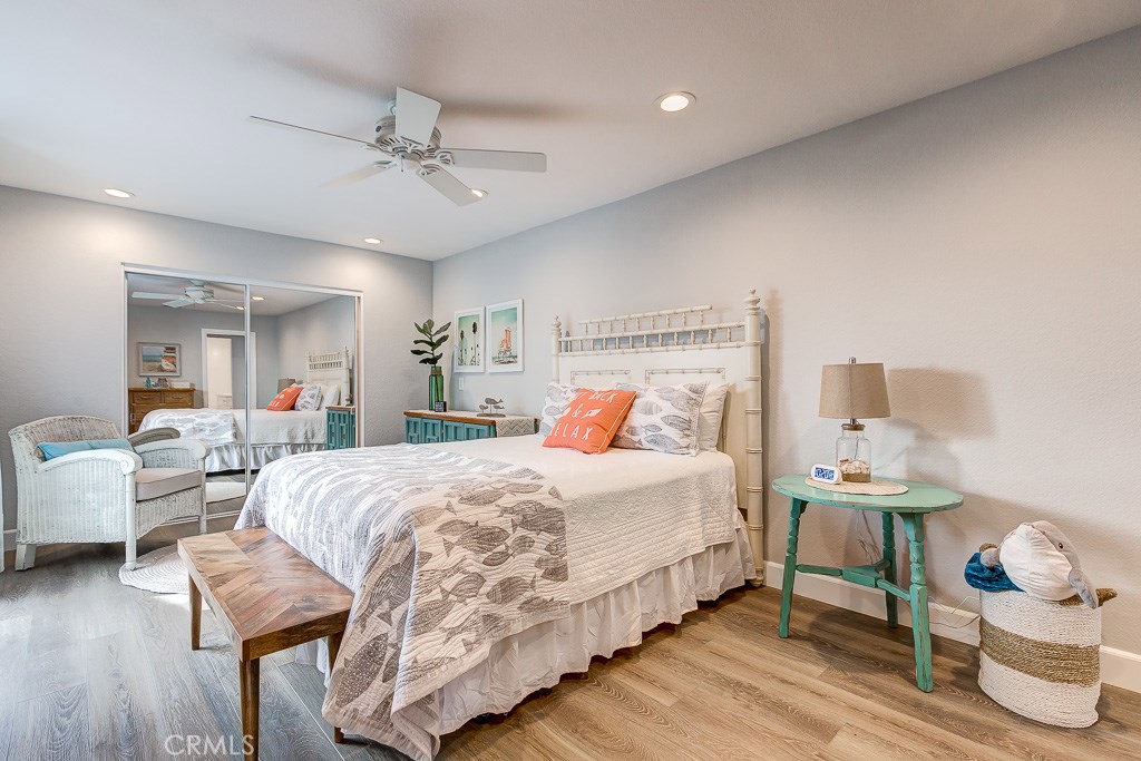 33531 Marlinspike Drive Dana Point, CA 92629 - Photo 15 of 52 a bedroom with a bed and wooden floor