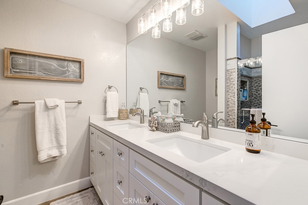 33531 Marlinspike Drive Dana Point, CA 92629 - Photo 18 of 52 a bathroom with double vanity sink and a mirror