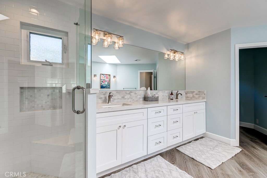 33531 Marlinspike Drive Dana Point, CA 92629 - Photo 21 of 52 a bathroom with a double vanity sink and mirror