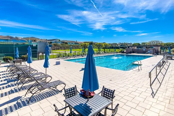 a view of a swimming pool with an ocean view