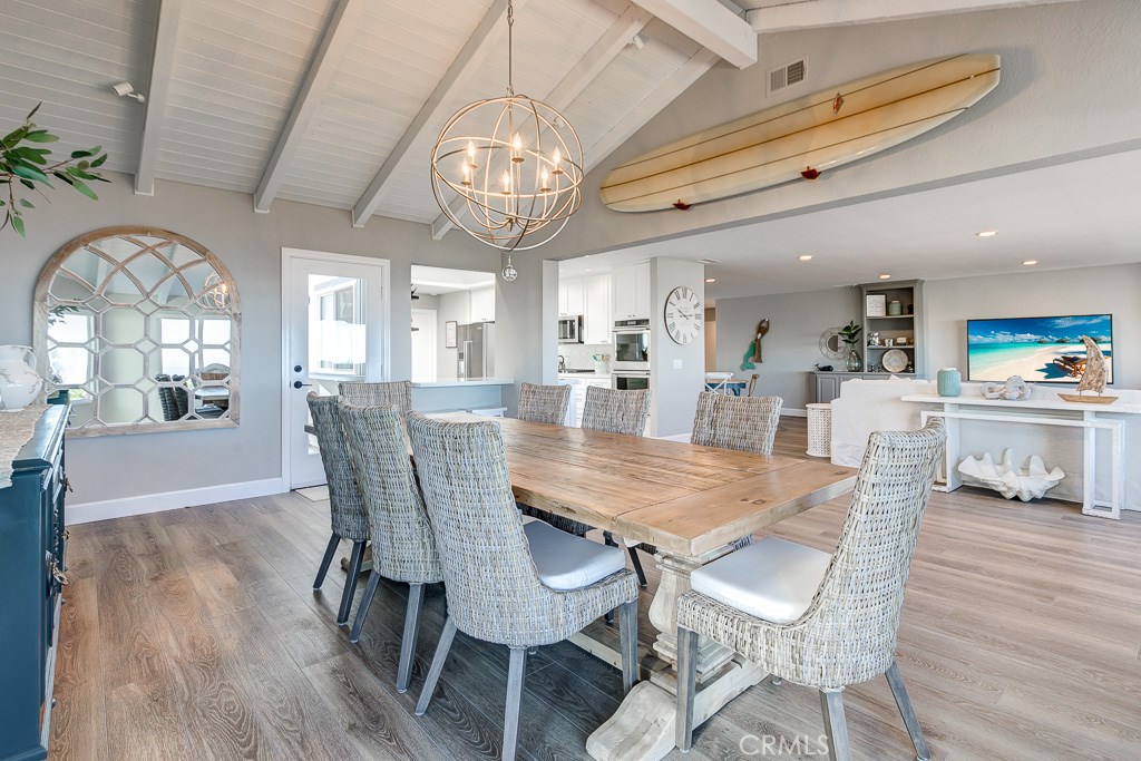 33531 Marlinspike Drive Dana Point, CA 92629 - Photo 6 of 52 a view of a dining room with furniture a chandelier and wooden floor