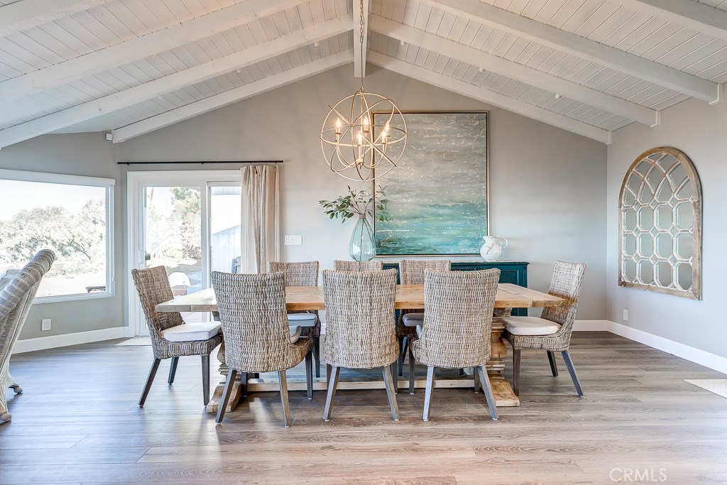 33531 Marlinspike Drive Dana Point, CA 92629 - Photo 7 of 52 a dining room with furniture a chandelier and wooden floor