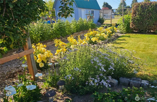 a kitchen with stainless steel appliances a refrigerator and wooden cabinets