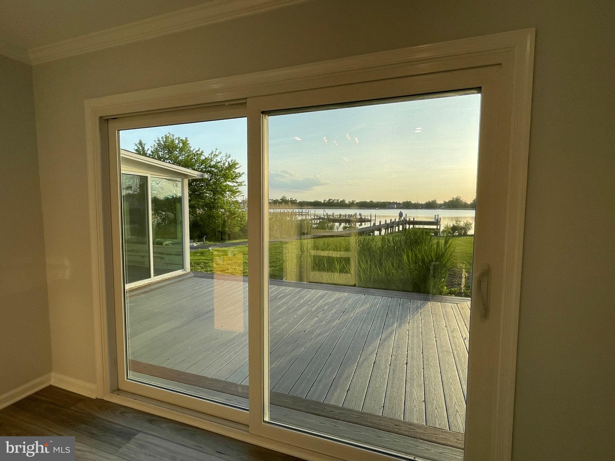 1819 Sherman Drive Chester, MD 21619 - Photo 11 of 36 a view of a room with a floor to ceiling window and an outdoor view