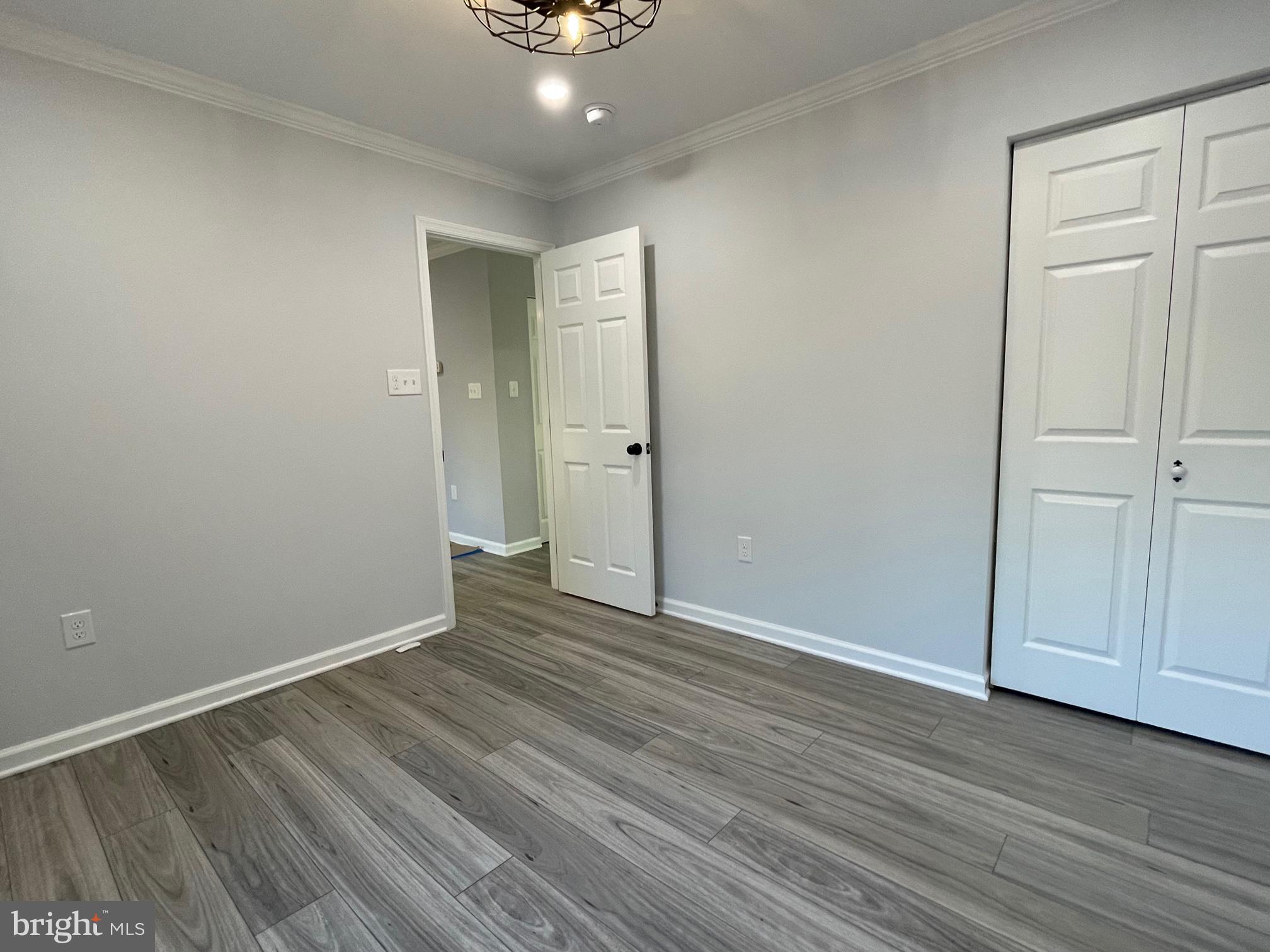 1819 Sherman Drive Chester, MD 21619 - Photo 6 of 36 a view of an empty room with wooden floor