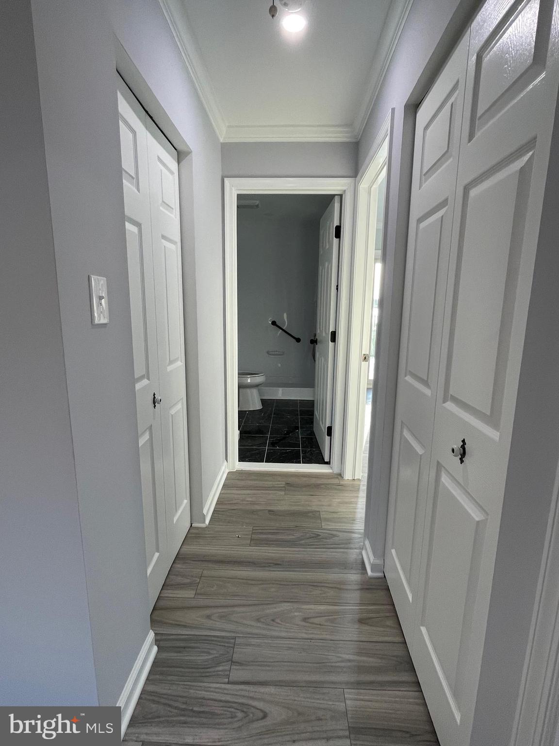 1819 Sherman Drive Chester, MD 21619 - Photo 7 of 36 a view of a hallway with wooden floor