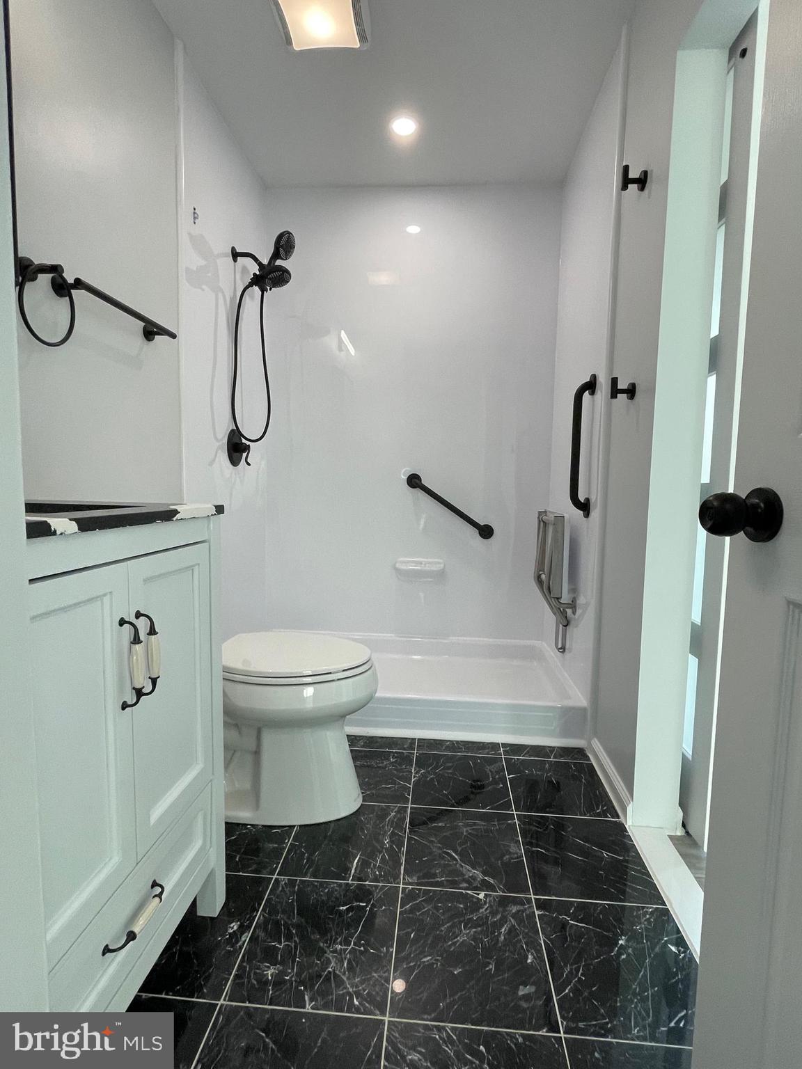 1819 Sherman Drive Chester, MD 21619 - Photo 9 of 36 a bathroom with a toilet and a shower