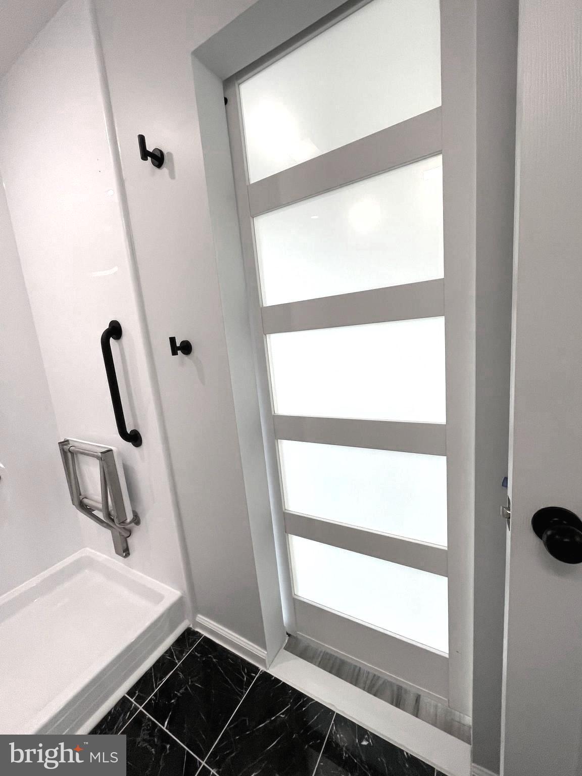 1819 Sherman Drive Chester, MD 21619 - Photo 10 of 36 a bathroom with a sink and a window