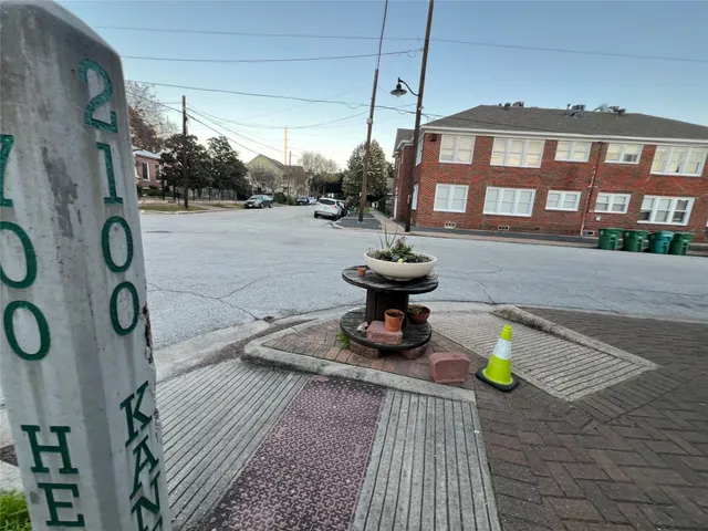 a front view of a house with sitting area