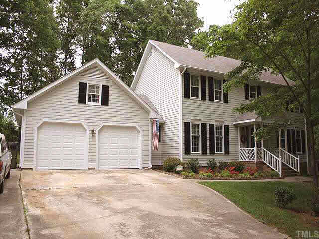 3012 Oxbow Court Raleigh, NC 27613 - Photo 1 of 9 a view of a white house with a yard and large tree