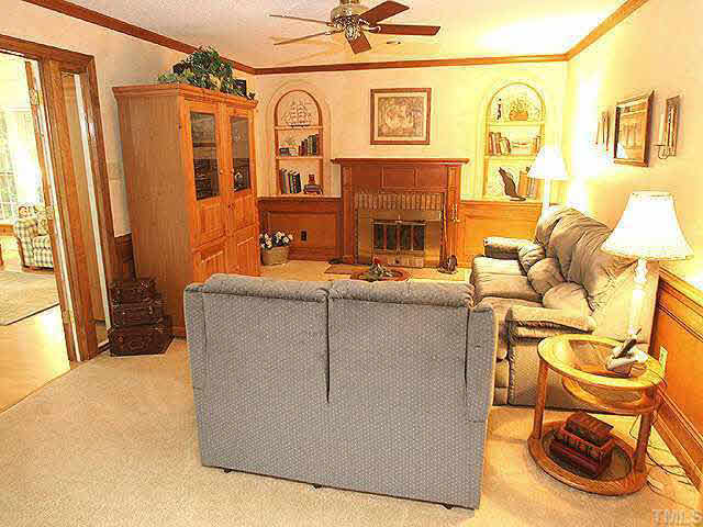 3012 Oxbow Court Raleigh, NC 27613 - Photo 2 of 9 a living room with fireplace furniture and a large window
