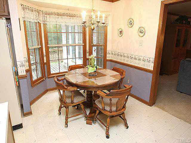 3012 Oxbow Court Raleigh, NC 27613 - Photo 5 of 9 a dining room with furniture and window