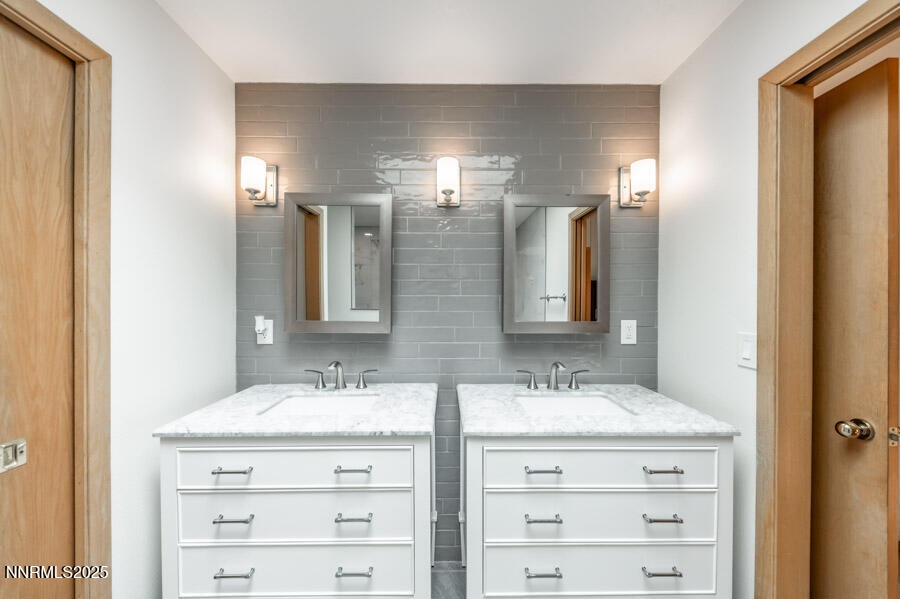 2220 Stone Mountain Circle Reno, NV 89519 - Photo 26 of 58 a bathroom with double sink and a mirror