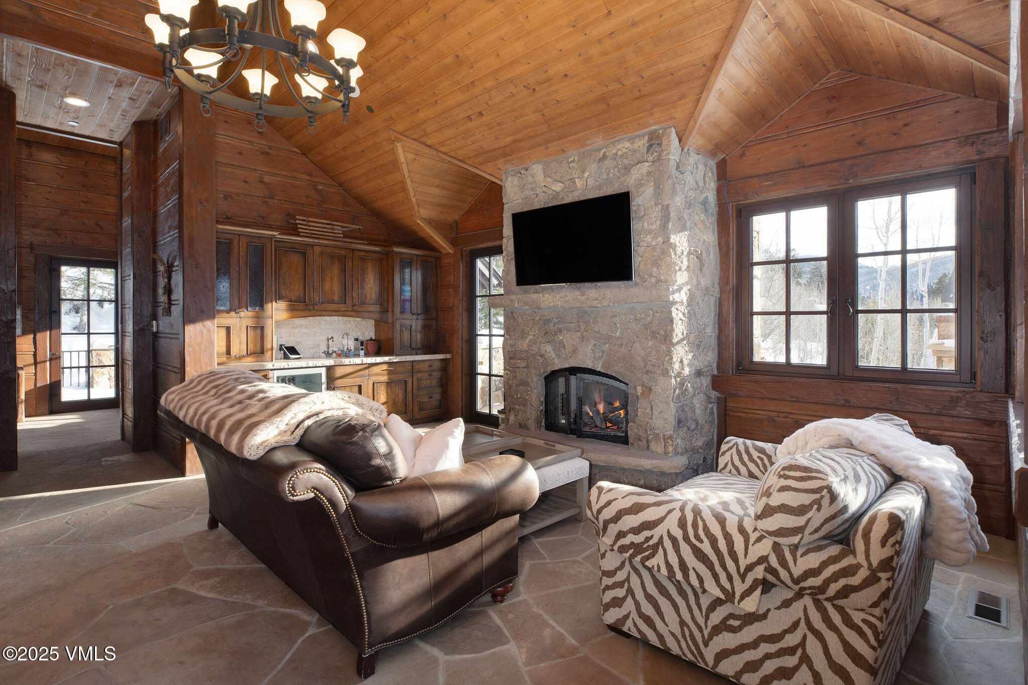 2195 Cresta Road Edwards, CO 81632 - Photo 12 of 43 a living room with furniture a fireplace and a flat screen tv