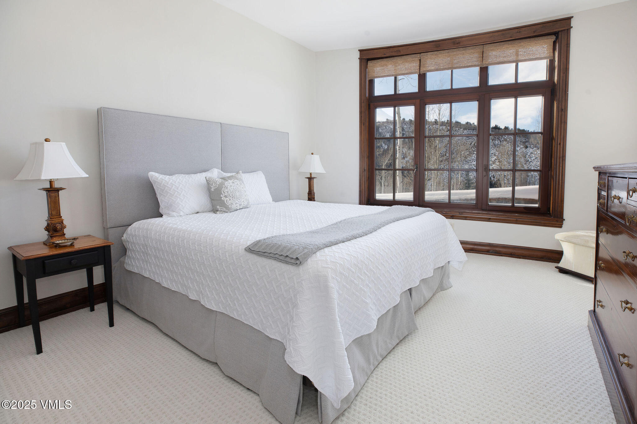 2195 Cresta Road Edwards, CO 81632 - Photo 18 of 43 a spacious bedroom with a bed and a large window