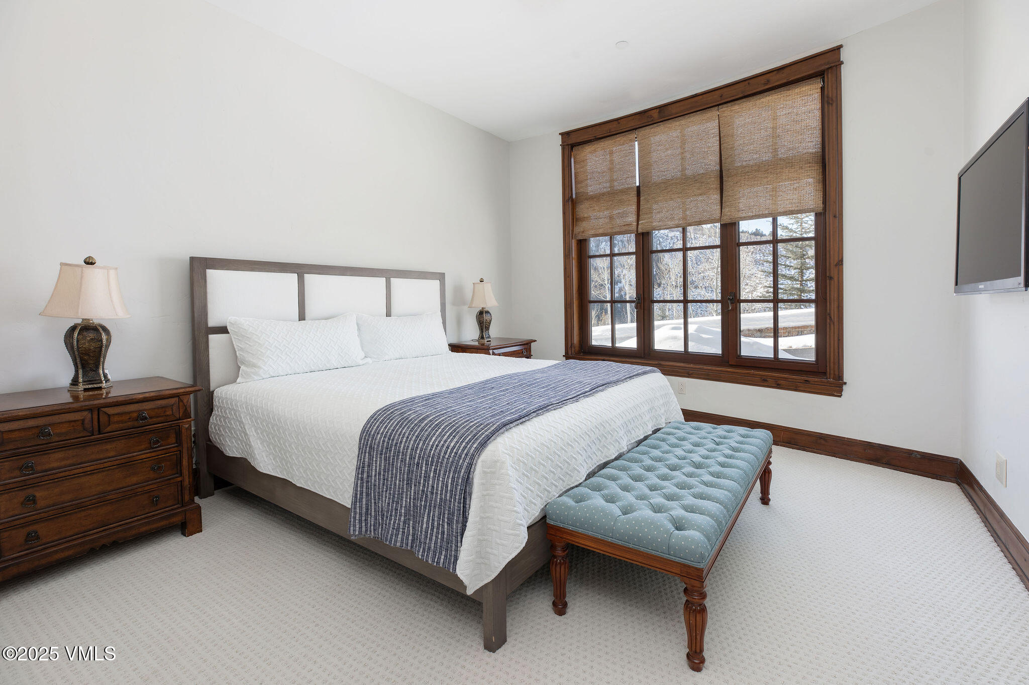 2195 Cresta Road Edwards, CO 81632 - Photo 19 of 43 a bedroom with a bed lamp and a window