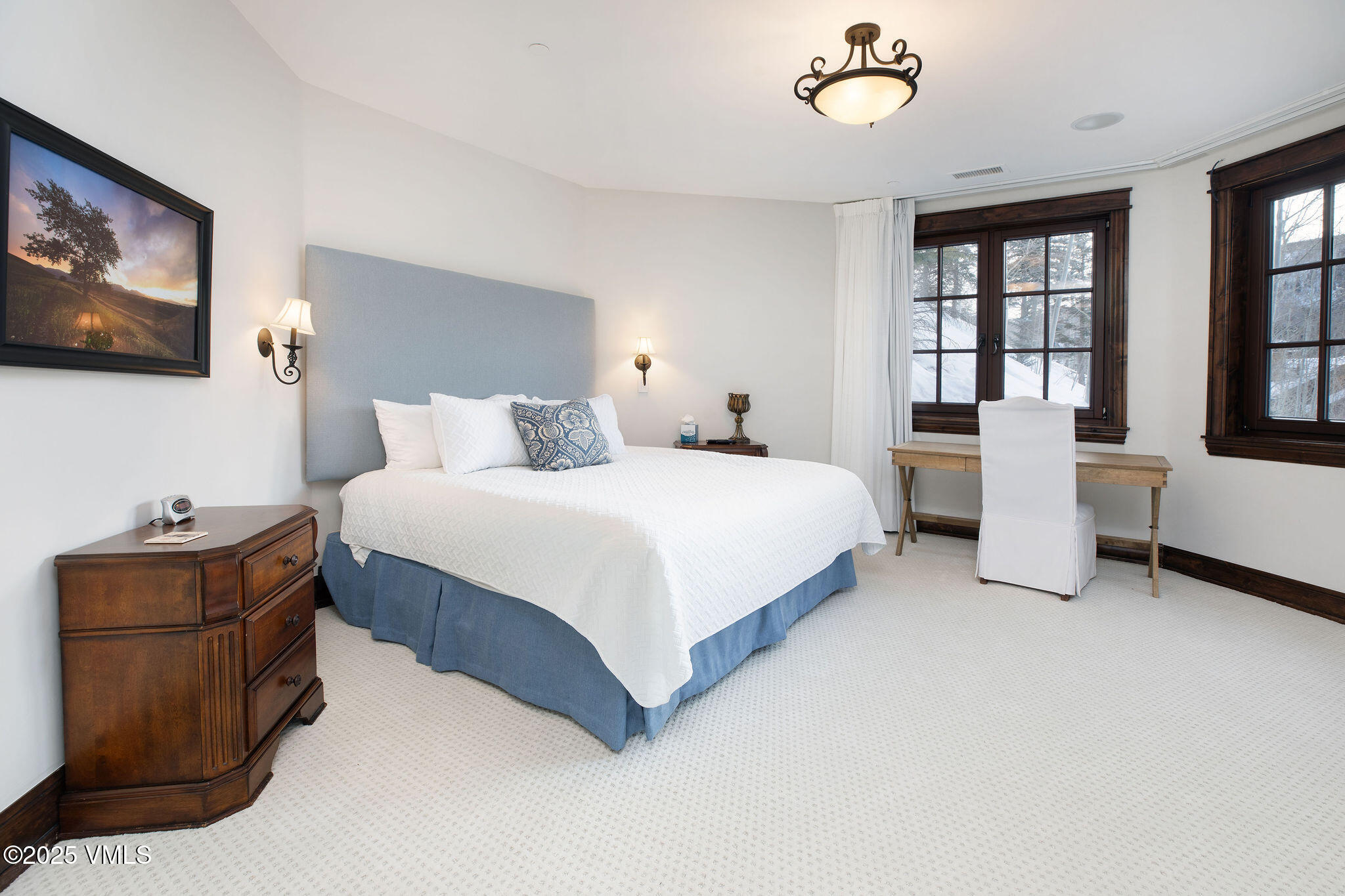 2195 Cresta Road Edwards, CO 81632 - Photo 20 of 43 a bedroom with a bed and a flat screen tv