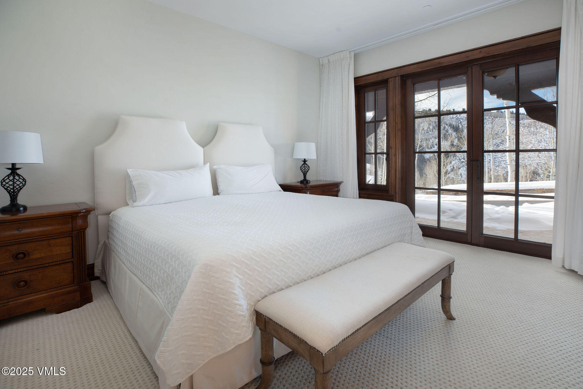 2195 Cresta Road Edwards, CO 81632 - Photo 21 of 43 a bedroom with a bed and a large window