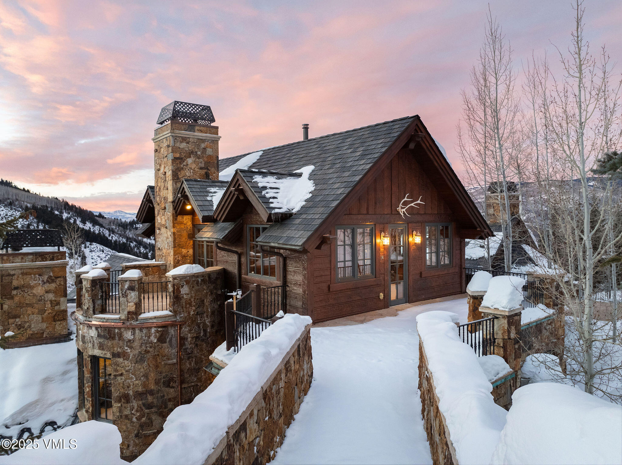 2195 Cresta Road Edwards, CO 81632 - Photo 38 of 43 a view of a house with couches chairs and wooden fence