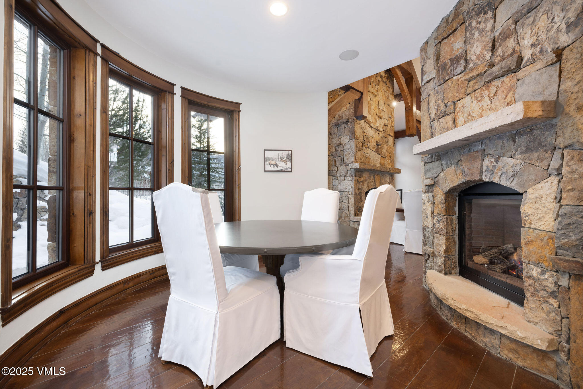 2195 Cresta Road Edwards, CO 81632 - Photo 10 of 43 a view of a dining room with furniture window and wooden floor