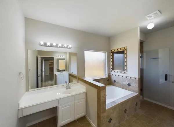 a bathroom with a sink and mirror