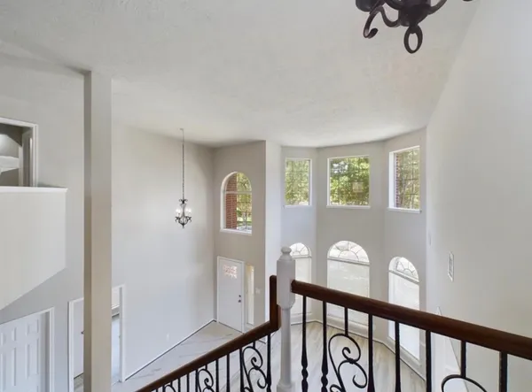 a view of a hallway with a window
