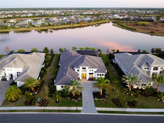 a kitchen with a dining table cabinets appliances and a counter top space
